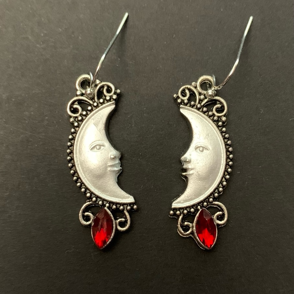 Silver Moon Face Drop Earrings with Red Gem Accent